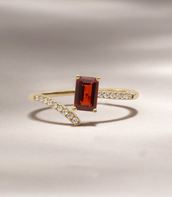 Mobile image of a garnet and diamond fashion ring