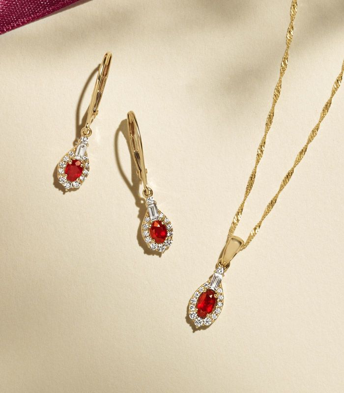 A ruby fashion pendant and matching fashion earrings
