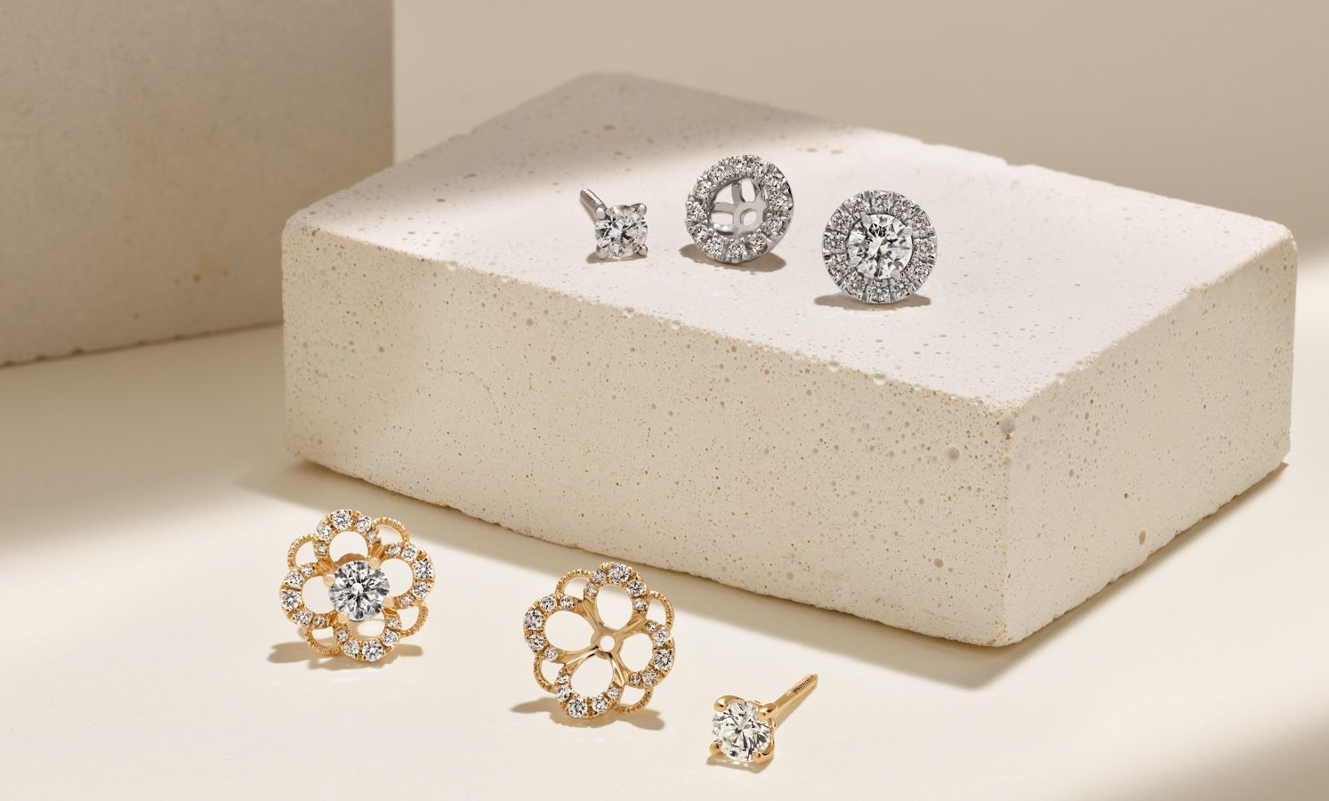 A collection of diamond studs and earring jackets