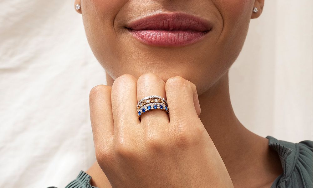 A Woman Wearing a Collection of Stackable Rings