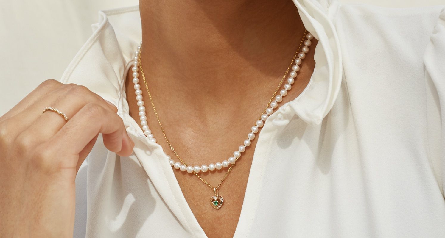 A woman wearing a pearl strand