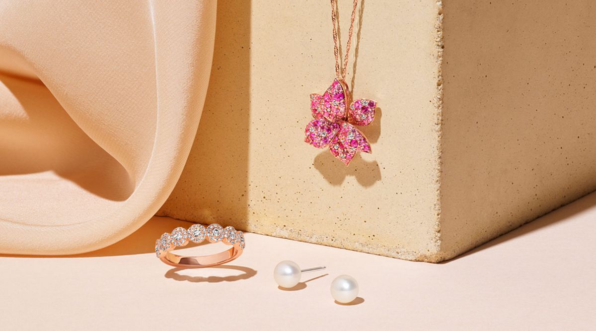 A fashion pendant, ring and a pair of pearl stud earrings