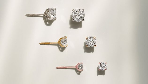 A collection of diamond stud earrings