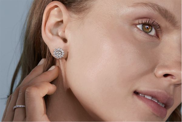 Mobile Image of a woman wearing diamond fashion earrings and a diamond fashion ring
