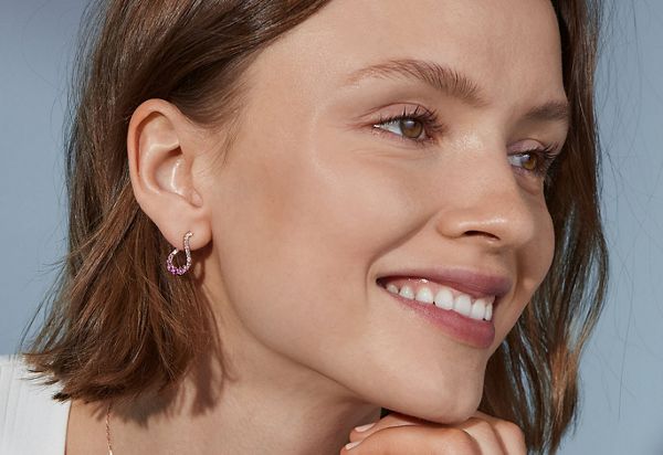 Mobile image of Side Profile of Woman Wearing Diamond Earrings