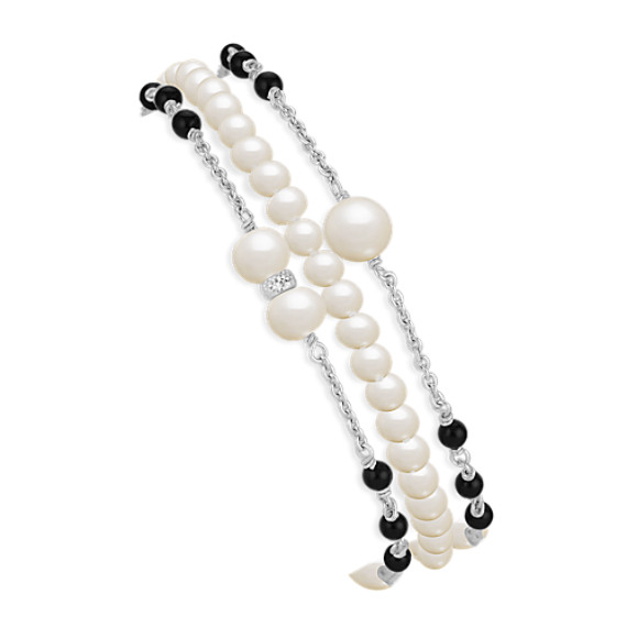 3.5-6mm Cultured Freshwater Pearl and Black Agate Bracelet in Sterling Silver (7.5") 3.5-6mm Cultured Freshwater Pearl and Black Agate Bracelet in Sterling Silver (7.5")