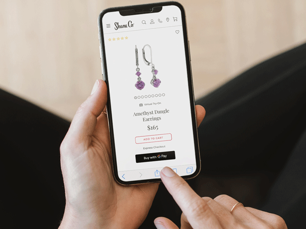 Gif of a woman using the virtual try-on experience for earrings