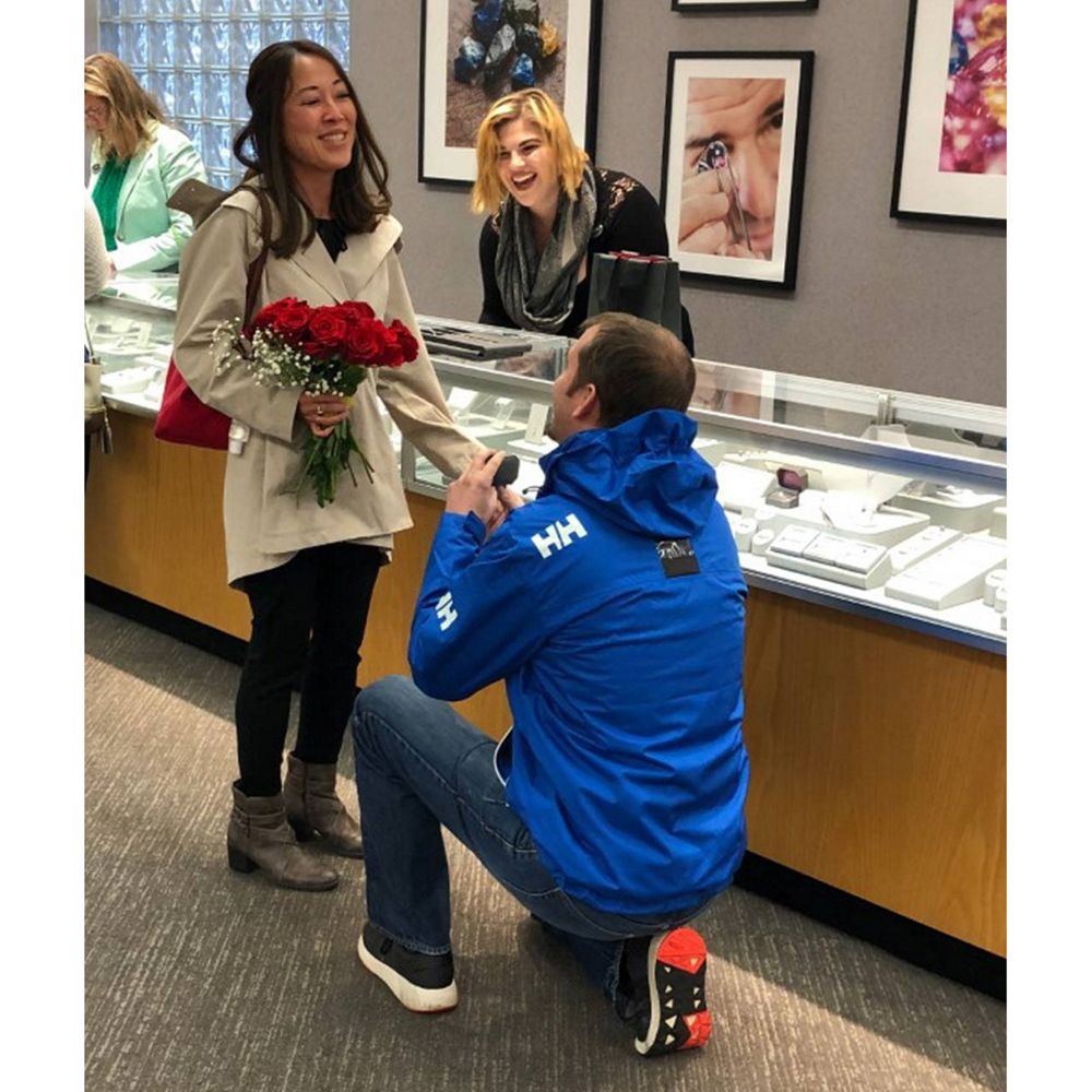Desktop Image of man proposing to his girlfriend in a store