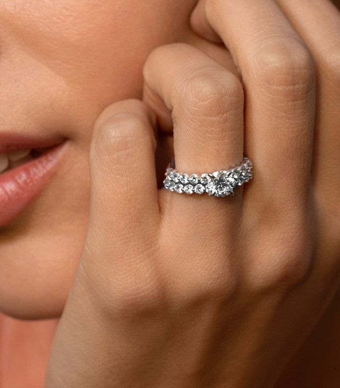 Woman Wearing A Matching Set Engagement Ring