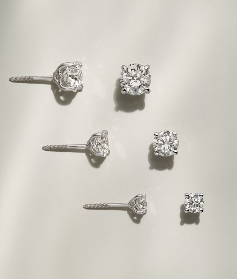 Several pairs of diamond solitaire studs of varying sizes