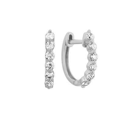 A pair of diamond huggie earrings