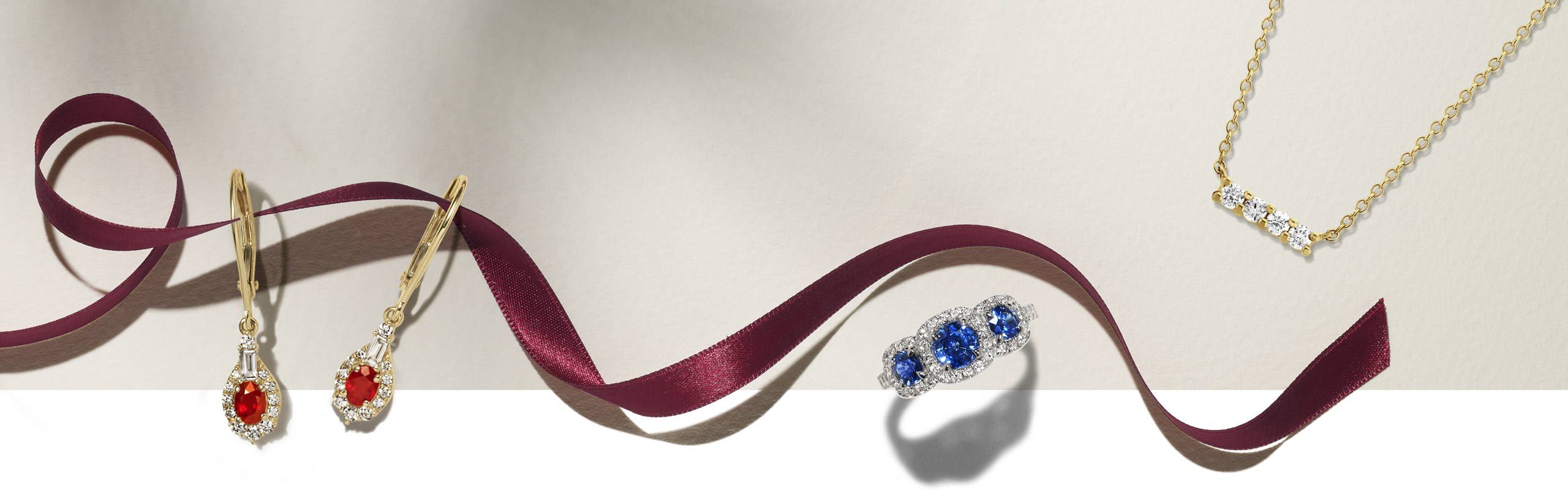 Image of holiday ribbon and classic jewelry