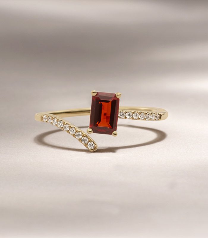 A garnet and diamond fashion ring