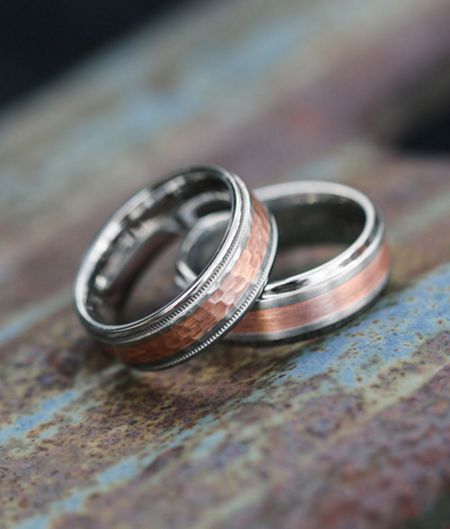 Two custom wedding bands stacked on top of each other