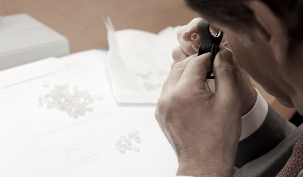 Man Inspecting a Diamond