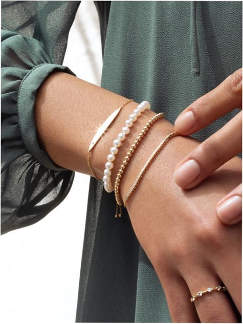 Woman Wearing multiple styles of bracelets