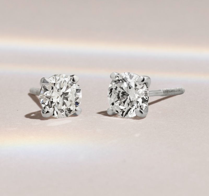 A pair of diamond stud earrings