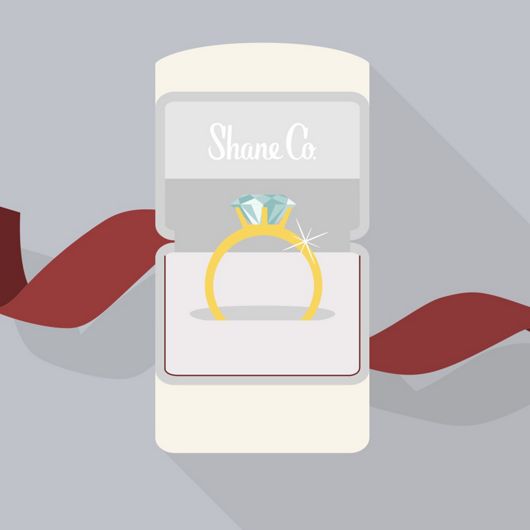 An illustration of an engagement ring in a Shane Co. box