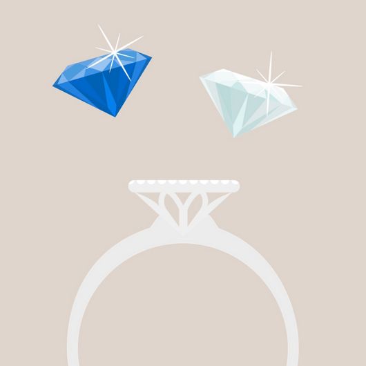 An illustration of an engagement ring setting with a loose diamond and loose sapphire