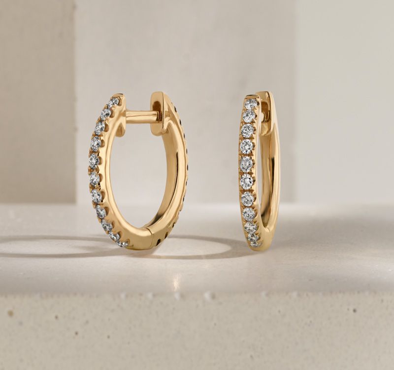 A pair of diamond hoop earrings