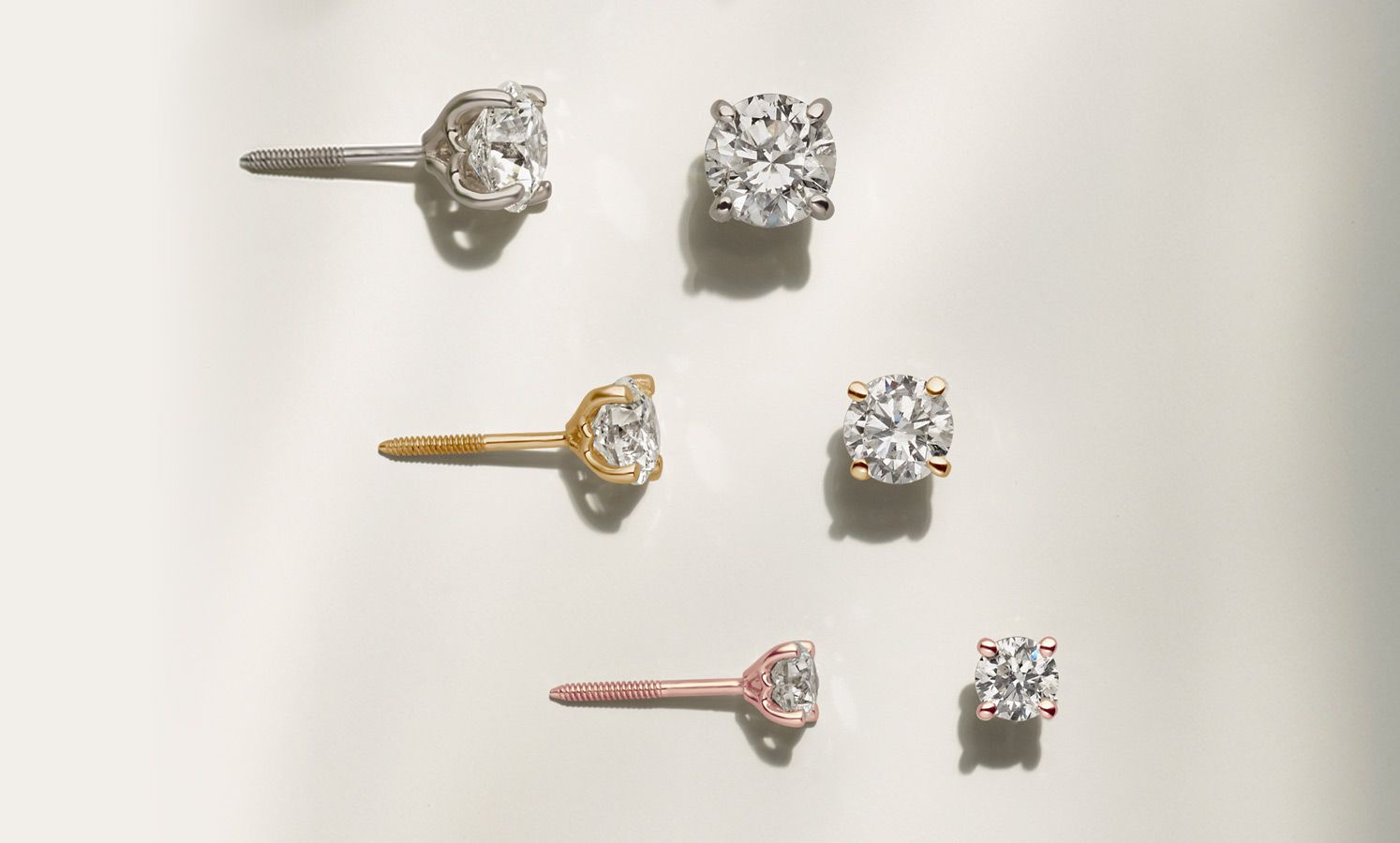 A collection of diamond stud earrings