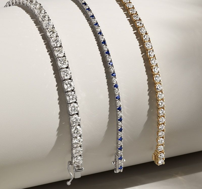 A collection of diamond tennis bracelets
