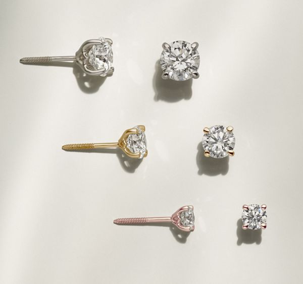 Mobile image of a collection of diamond stud earrings