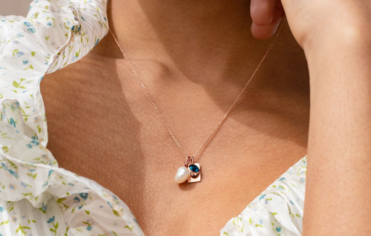 A woman wearing a fashion pendant necklace