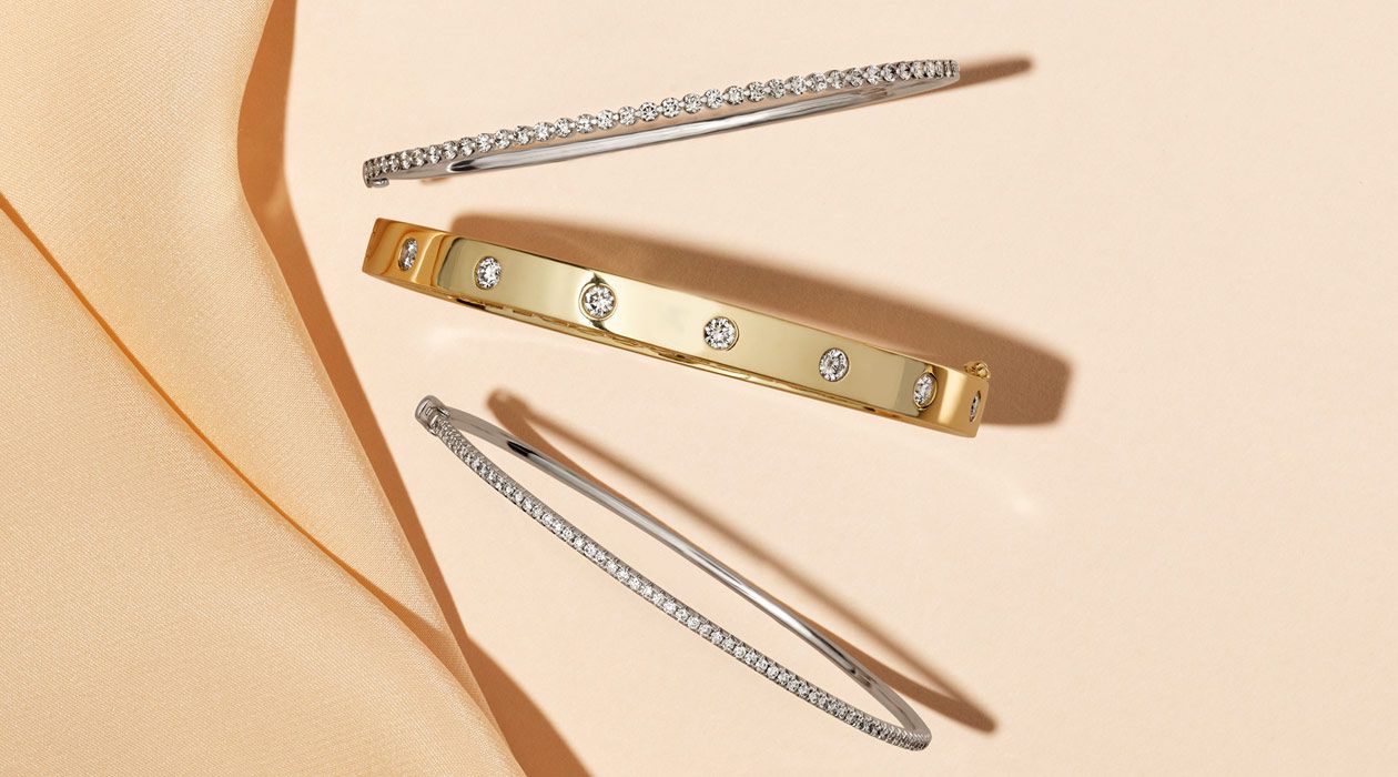 A collection of diamond bangle bracelets