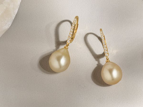 Mobile image of a pair of diamond and pearl earrings