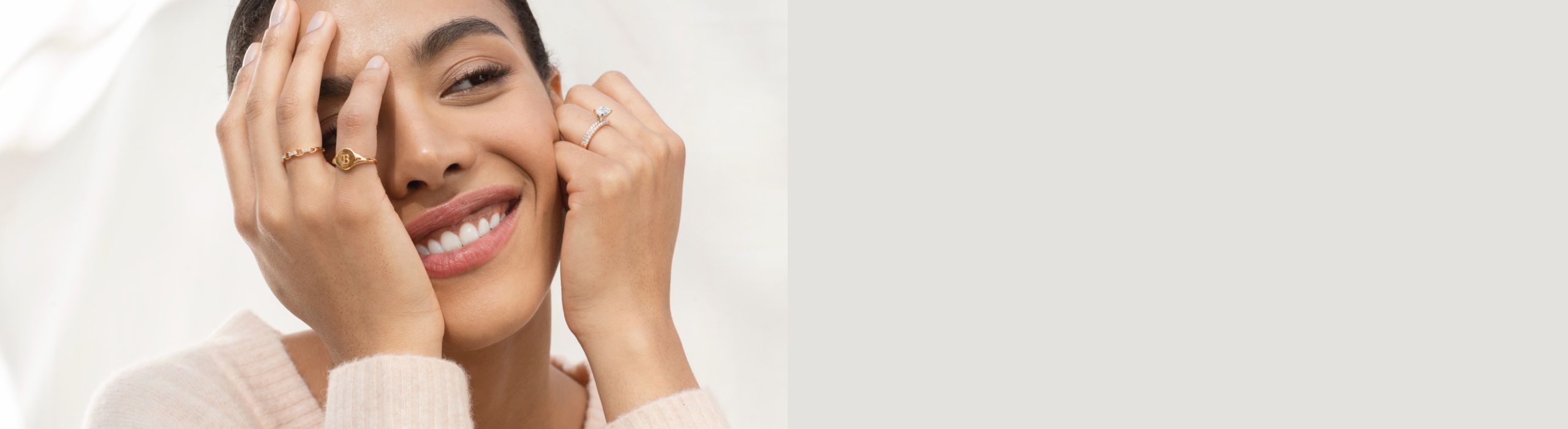 A woman wearing a collection of fashion rings