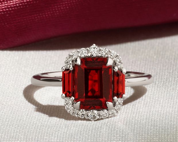 A garnet and diamond fashion rings