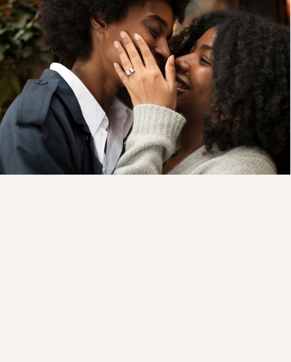 Mobile Image of a couple smiling and embracing