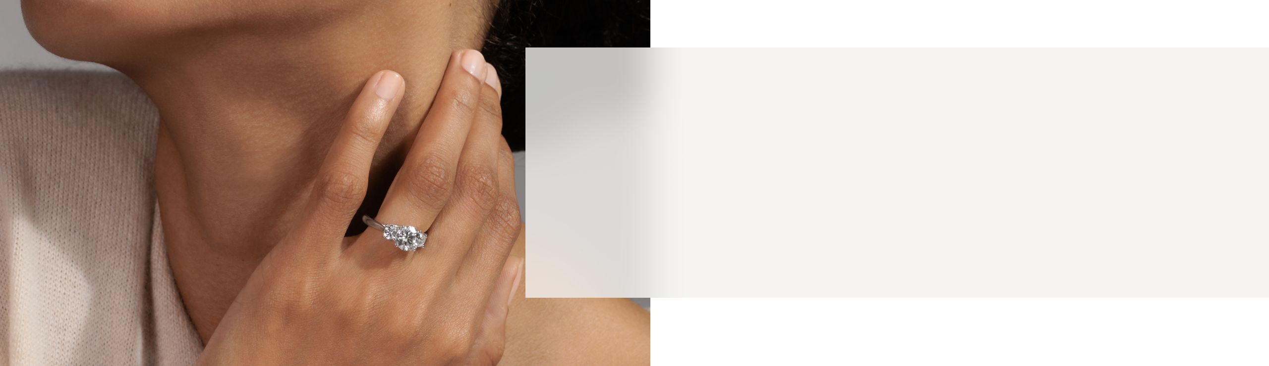 A woman wearing a diamond engagement ring