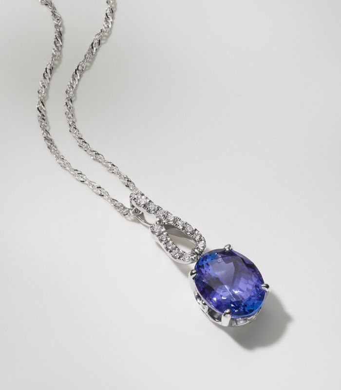 A blue topaz and diamond pendant