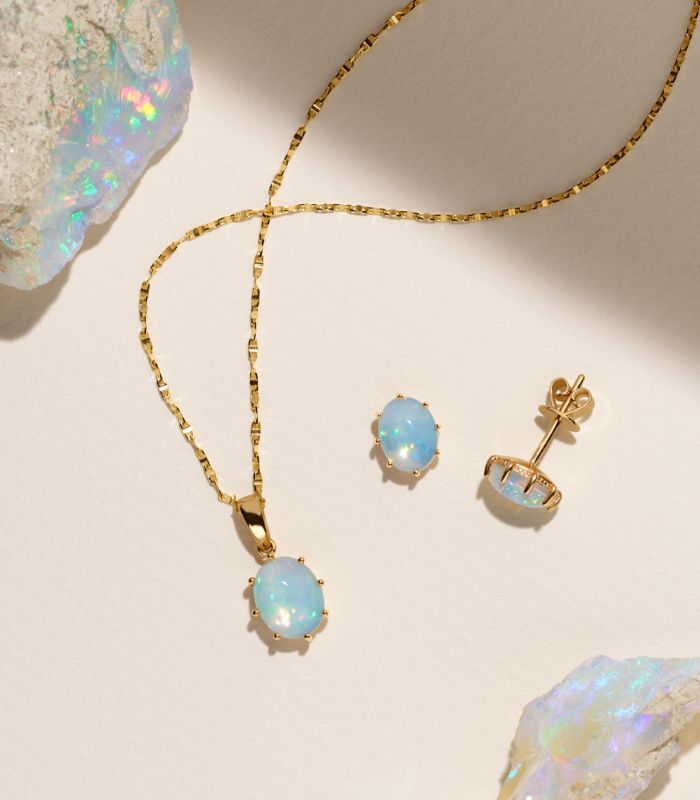 A pair of opal earrings and an opal pendant