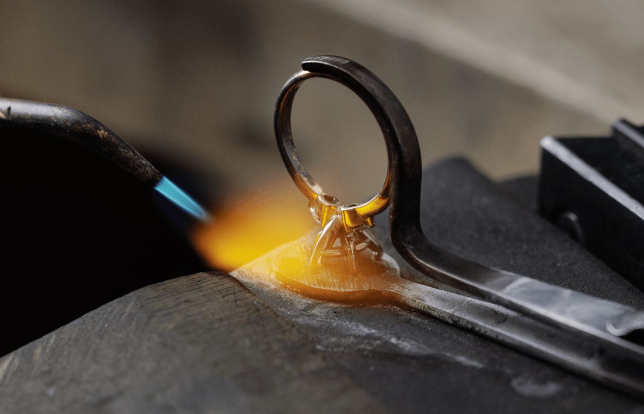 A jewelers torch working on an engagement ring