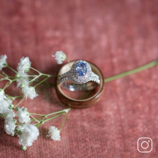 A diamond wedding set with a colored gemstone center stone