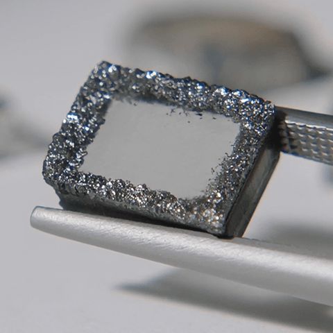 Carbon formed around the lab grown diamond seed