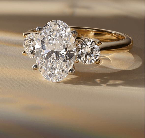 A lab-grown 3 stone diamond engagement ring