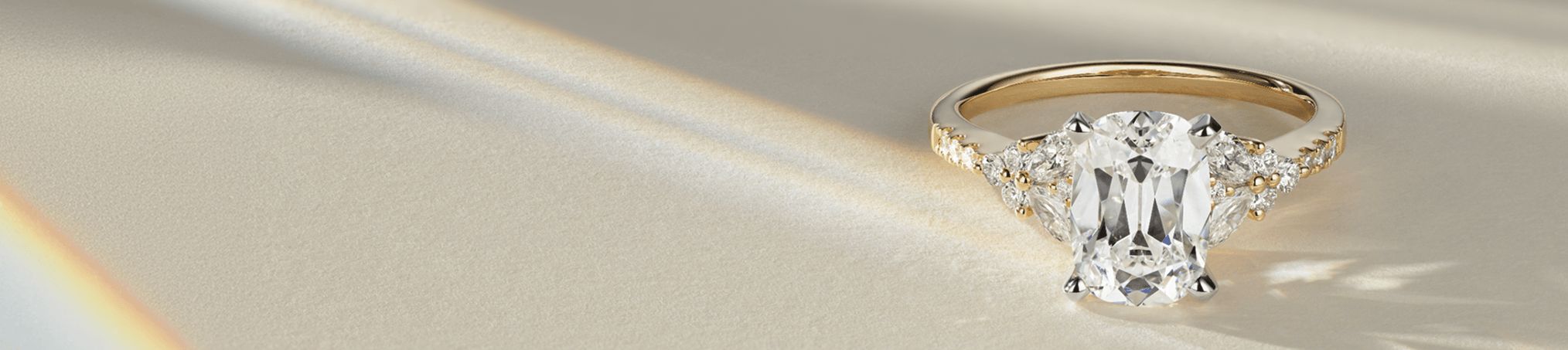 A diamond engagement ring with an oval center stone