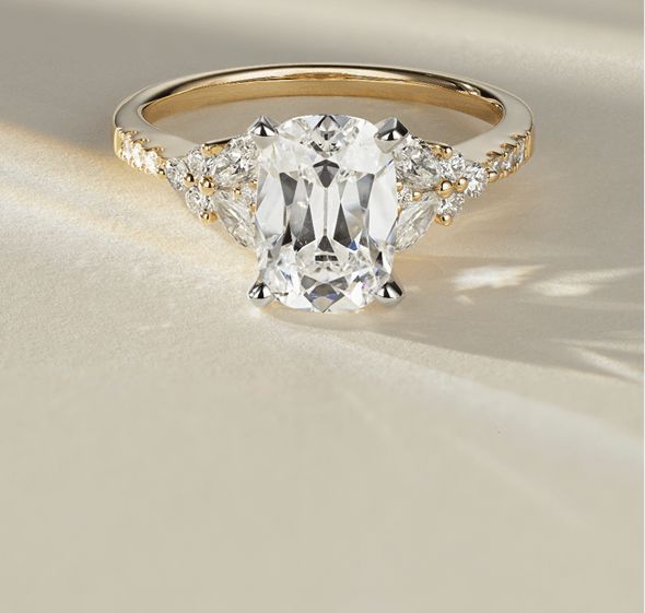 A diamond engagement ring with an oval center stone