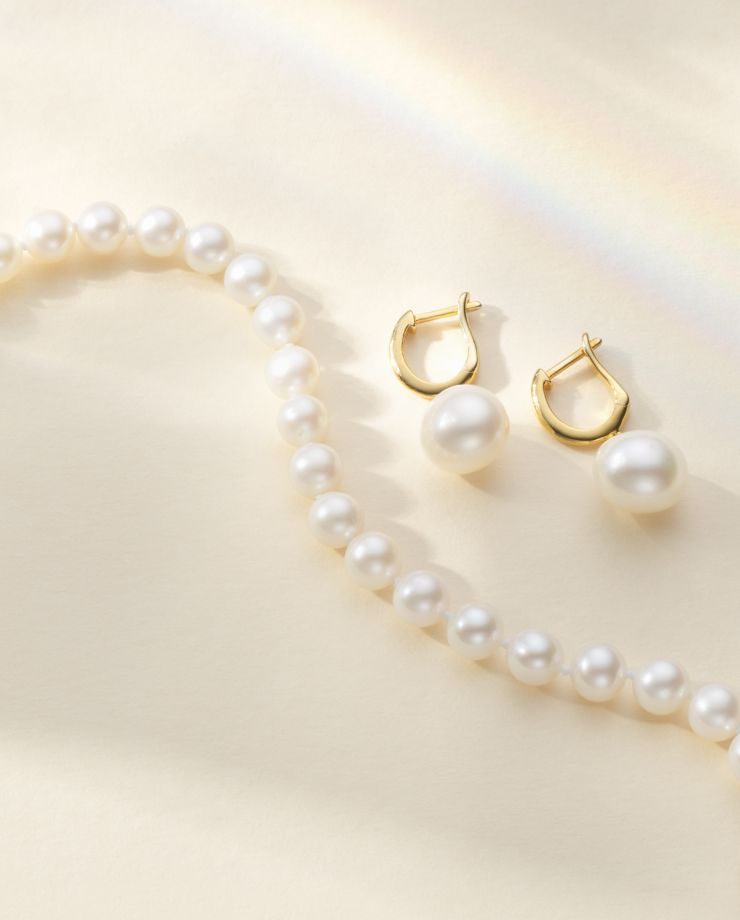A pearl strand and a pair of pearl earrings