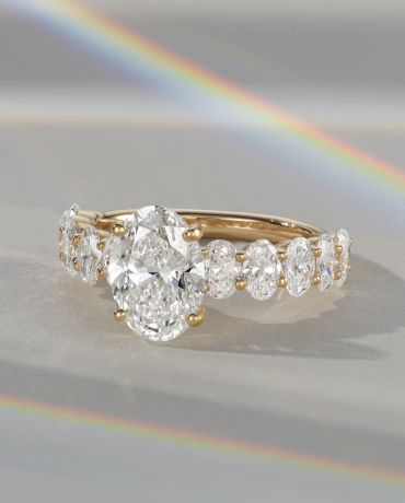 A diamond engagement ring with an oval center stone