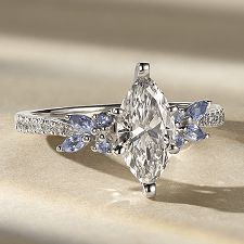 A diamond nature inspired engagement ring with a marquise center stone