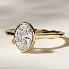 A diamond bezel set engagement ring