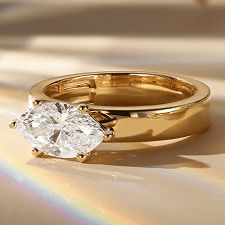 A diamond east-west set engagement ring