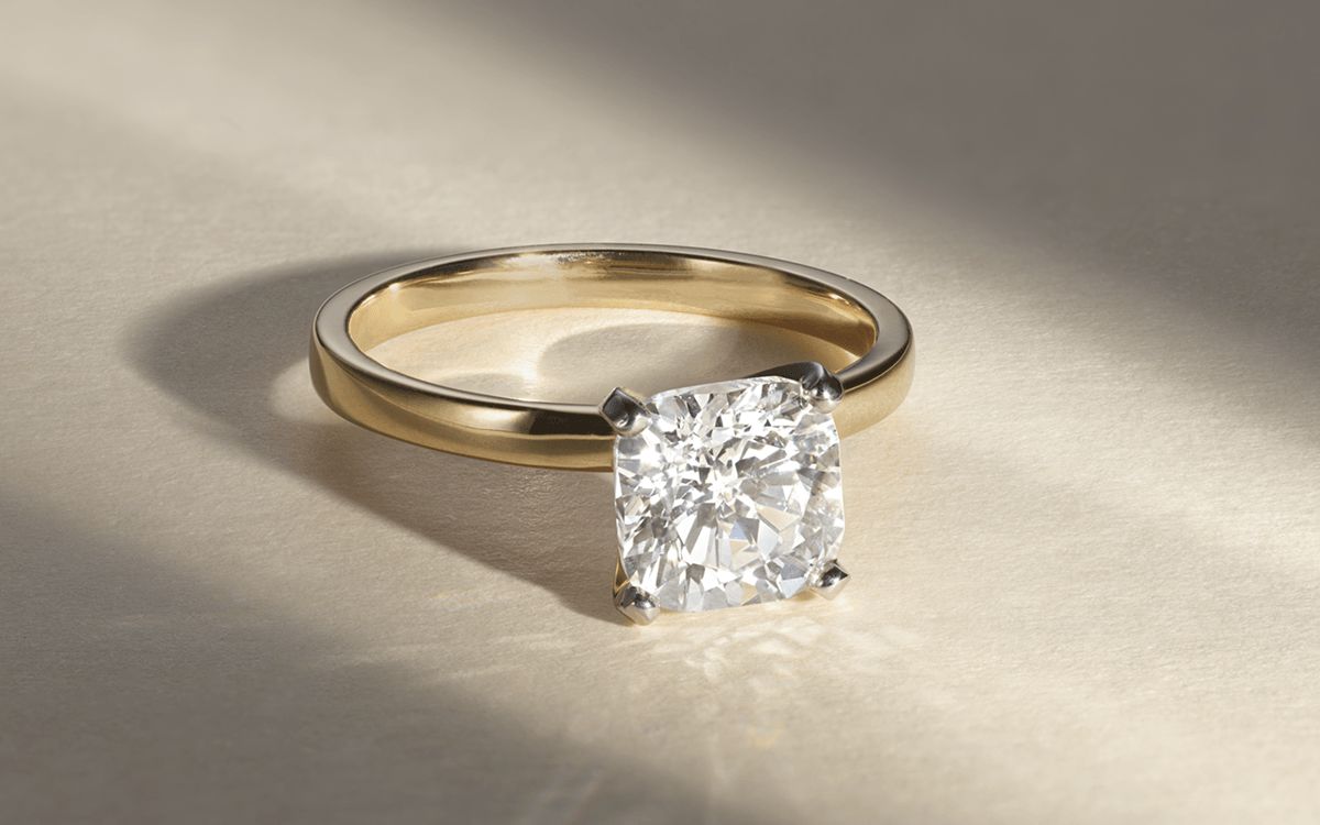 A solitaire diamond engagement ring