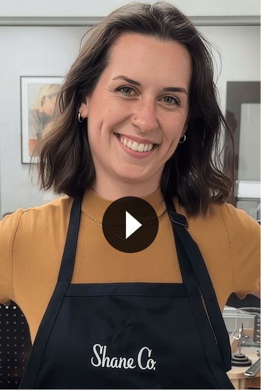 A smiling Shane Co. jeweler