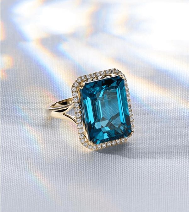 A gemstone and diamond fashion ring for December birthstones.